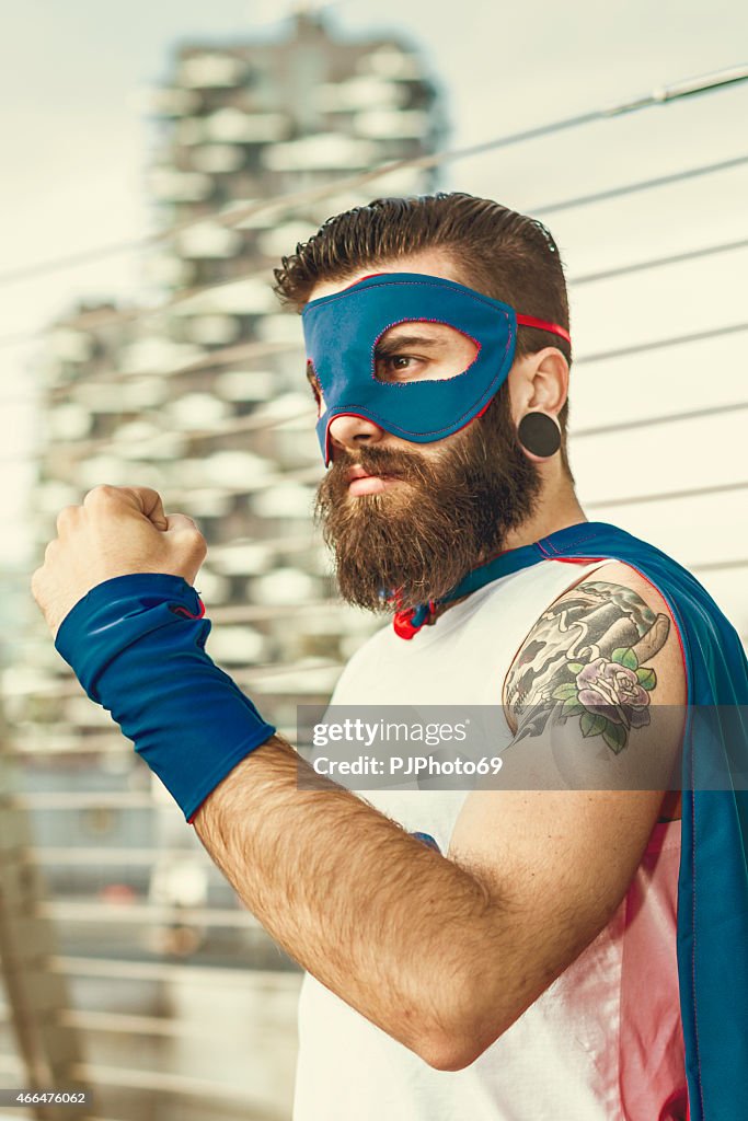 Hipster superhero showing fist