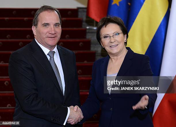 Swedish Prime Minister Stefan Loefven and his Polish counterpart Ewa Kopacz shake hands at a meeting in Warsaw on March 16, 2015. AFP PHOTO/JANEK...