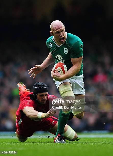 Paul O'Connell of Ireland is tackled by Luke Charteris of Wales during the RBS Six Nations match between Wales and Ireland at Millennium Stadium on...