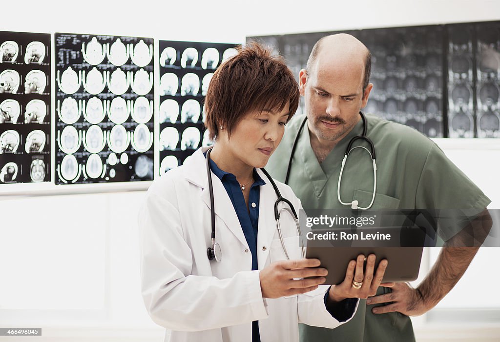 Doctor looking at digital tablet in clinic