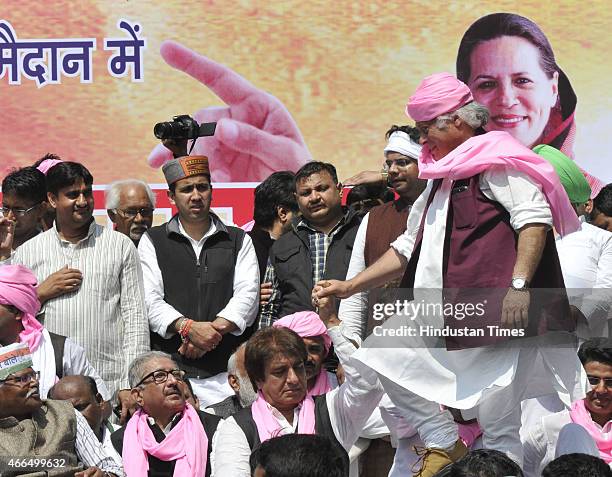 Congress leaders Jairam Ramesh and Raj Babbar shared the stage during their protest against the Land Acquisition bill at Jantar Mantar on March 16,...