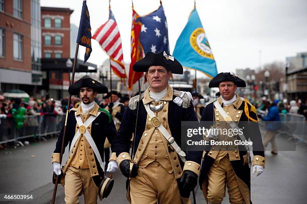 Members of the Lexington Minutemen march during the St. Patrick's Day Parade in the South Boston neighborhood on March 15, 2015.