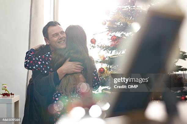 father giving christmas wishes to his daughter - christmas morning stock pictures, royalty-free photos & images