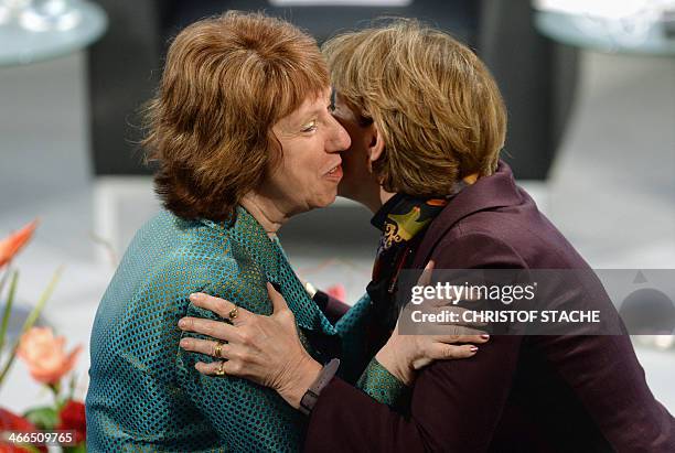 The European Union's High Representative for Foreign Affairs and Security Policy Catherine Ashton greets an unidentified participant of the 50th...