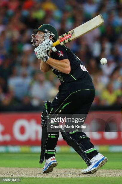 Cameron White of Australia is hit as he bats during game three of the International Twenty20 series between Australia and England at ANZ Stadium on...