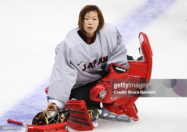 Ice hockey goalkeeper Azusa Nakaoku of Japan attends a practice session ahead of the Sochi 2014 Winter Olympics at Shayba Arena on February 2, 2014...