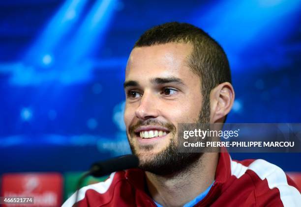 Atletico Madrid's midfielder Mario Suarez smiles during a press conference at the Vicente Calderon stadium in Madrid March 16, 2015 on the eve of the...