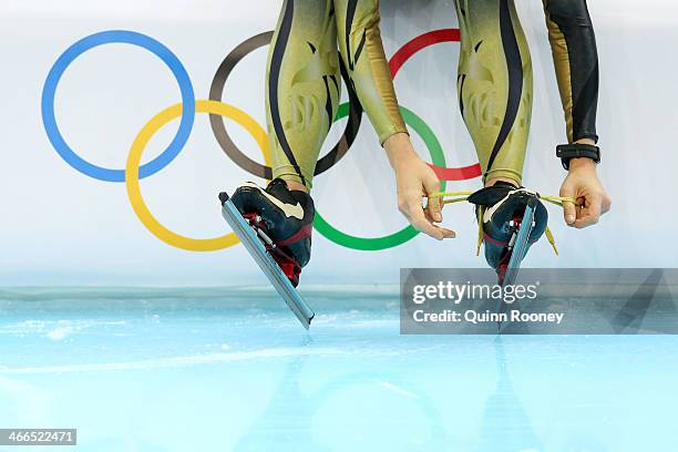 Member of the Japan speed skating team prepares to practise on the ice during a training session ahead of the Sochi 2014 Winter Olympics at Adler...