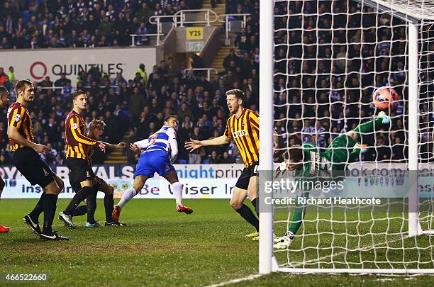 Hal Robson-Kanu of Reading heads the opening goal during the FA Cup Quarter Final Replay match between Reading and Bradford City at Madejski Stadium...