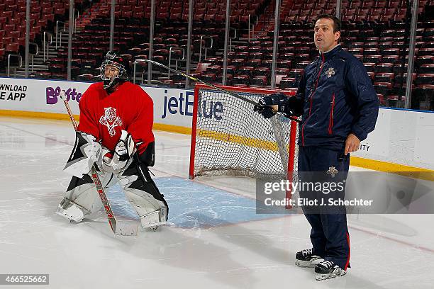 ESPNs Linda Cohn stands in front of the net while Florida Panthers Goaltending Coach Robb Tallas gives directions during the Goal of a Lifetime...