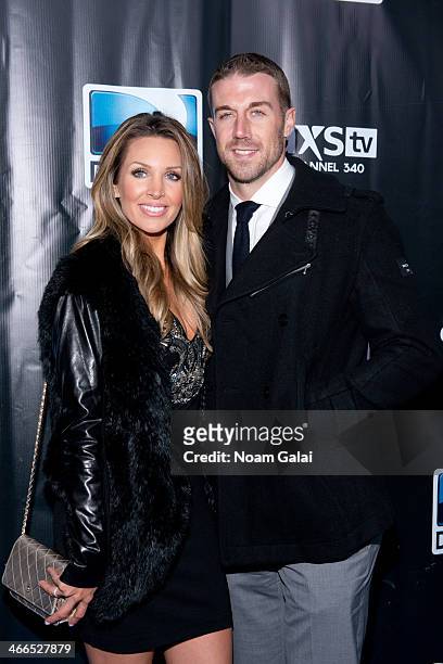 Quaterback Alex Smith and his wife Elizabeth Barry attend the DirecTV Super Saturday Night at Pier 40 on February 1, 2014 in New York City.
