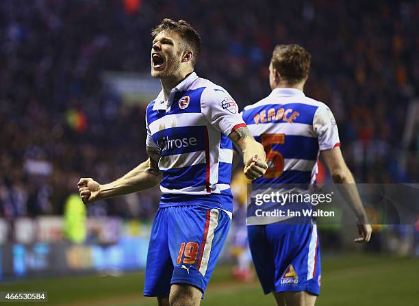 Jamie Mackie of Reading celebrates scoring his team's third goal during the FA Cup Quarter Final Replay match between Reading and Bradford City at...