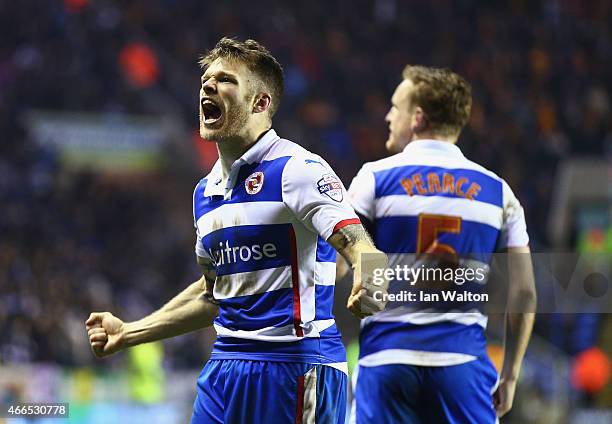 Jamie Mackie of Reading celebrates scoring his team's third goal during the FA Cup Quarter Final Replay match between Reading and Bradford City at...