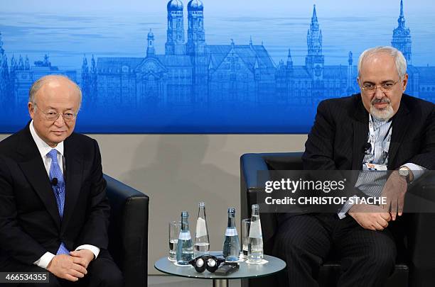 Iranian Foreign Minister Mohammad Javad Zarif and the Director General of the International Atomic Energy Agency Yukiya Amano attend a panel...