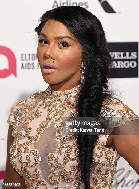 Lil' Kim attends the Elton John AIDS Foundation's 23rd annual Academy Awards Viewing Party at The City of West Hollywood Park on February 22, 2015 in...