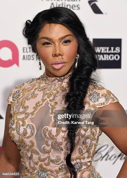 Lil' Kim attends the Elton John AIDS Foundation's 23rd annual Academy Awards Viewing Party at The City of West Hollywood Park on February 22, 2015 in...