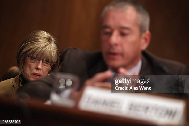 Judy Rivers of Logan, Alabama, who twice had been listed in the Social Security Death Master File, listens as director of education, workforce and...