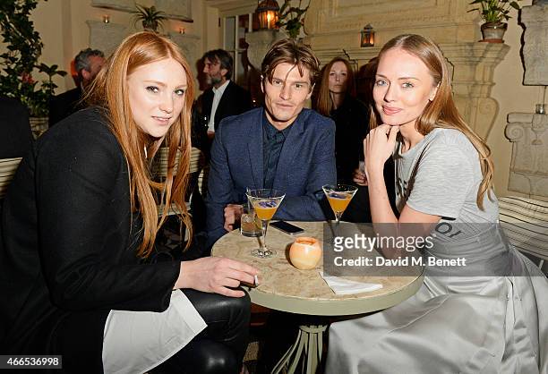 Aimee Croysdill, Oliver Cheshire and Laura Haddock attend the "Dior And I" UK Premiere after party at Loulou's on March 16, 2015 in London, England.