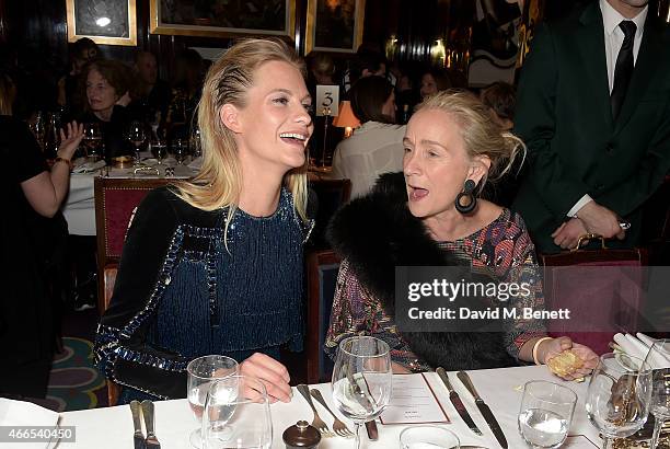 Poppy Delevingne and Lucinda Chambers attend the dinner, hosted by Olivier Rousteing, to mark the opening of Balmain's first London store, at...