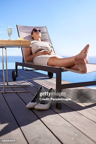 isn't this the life... - poolside stock pictures, royalty-free photos & images