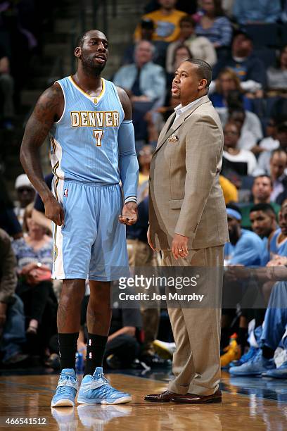 Hickson and Melvin Hunt of the Denver Nuggets speak during a game against the Memphis Grizzlies on March 16, 2015 at FedExForum in Memphis,...