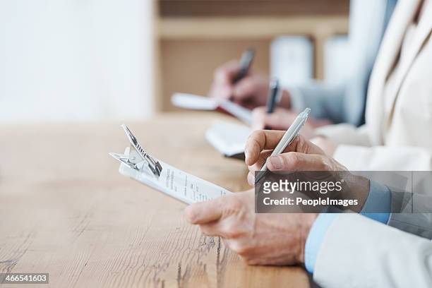 taking notes at the agm - employee engagement survey stock pictures, royalty-free photos & images