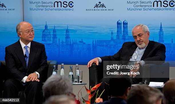 Director General of the International Atomic Energy Agency Yukiya Amano and Iranian Foreign Minister Mohammed Javad Zarif meet during the 50th Munich...