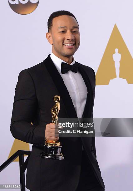 Recording artist John Legend poses in the press room during the 87th Annual Academy Awards at Loews Hollywood Hotel on February 22, 2015 in...