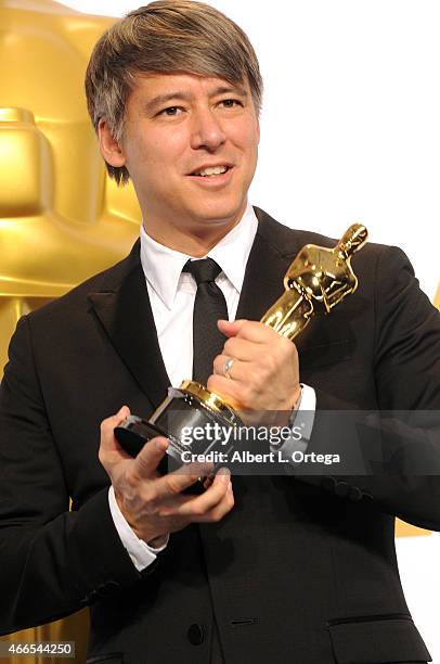 Editor Tom Cross winner of the Best Film Editing Award for 'Whiplash' poses inside the press room of the 87th Annual Academy Awards held at Loews...