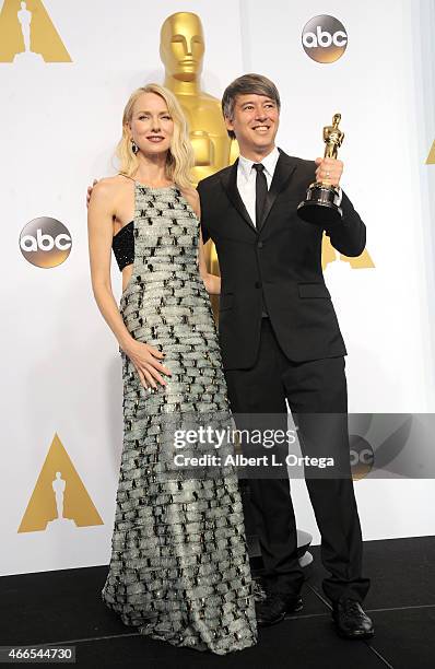 Actress Naomi Watts and editor Tom Cross winner of the Best Film Editing Award for 'Whiplash' poses inside the press room of the 87th Annual Academy...