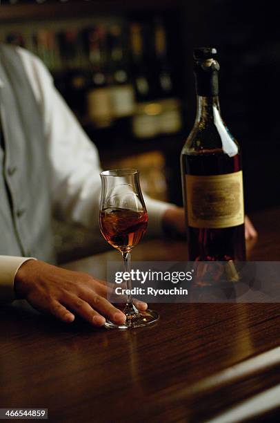 armagnac and bartender and bar - wooden wine press stock pictures, royalty-free photos & images