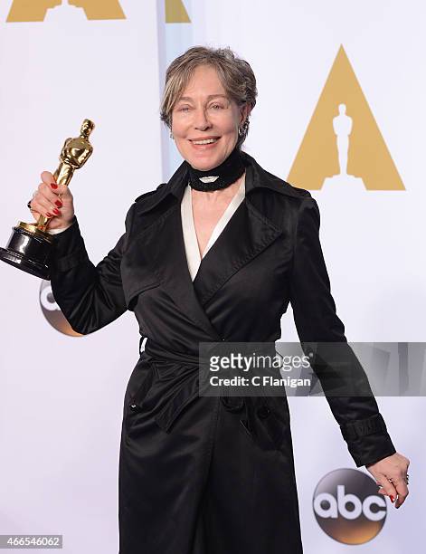 Milena Canonero poses in the press room with her Award for Best Costume Design at the 87th Annual Academy Awards at Hollywood & Highland Center on...