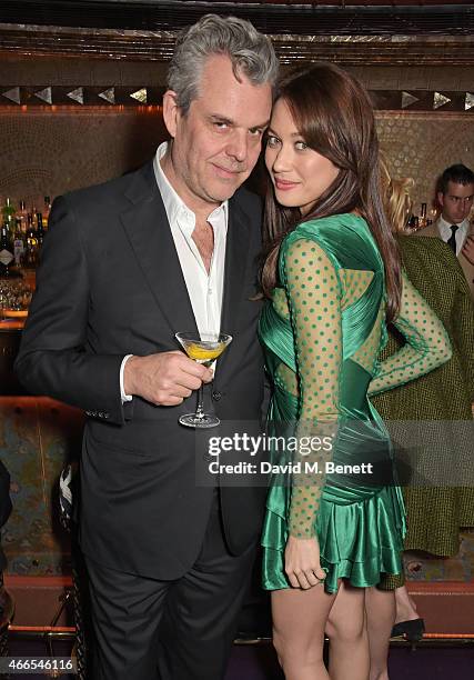 Danny Huston and Olga Kurylenko attend the "Dior And I" UK Premiere after party at Loulou's on March 16, 2015 in London, England.