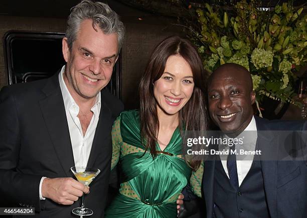 Danny Huston, Olga Kurylenko and Ozwald Boateng attend the "Dior And I" UK Premiere after party at Loulou's on March 16, 2015 in London, England.