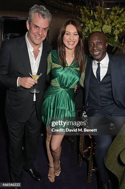 Danny Huston, Olga Kurylenko and Ozwald Boateng attend the "Dior And I" UK Premiere after party at Loulou's on March 16, 2015 in London, England.