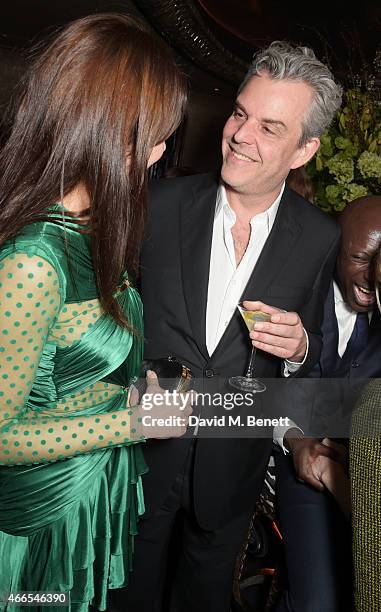 Olga Kurylenko and Danny Huston attend the "Dior And I" UK Premiere after party at Loulou's on March 16, 2015 in London, England.