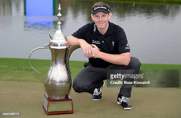 Stephen Gallacher of Scotland with the winners trophy after the final round of the Omega Dubai Desert Classic on the Majlis Course at the Emirates...