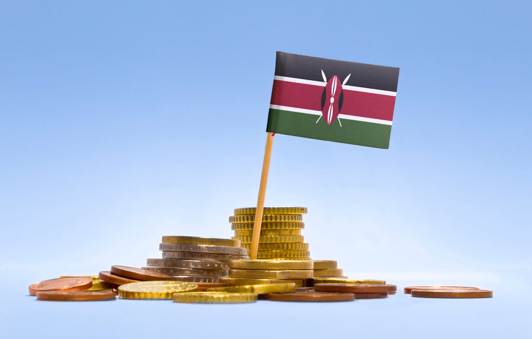 Flag of Kenya in a stack of coins.(series) Flag of Kenya in a stack of coins.(series)