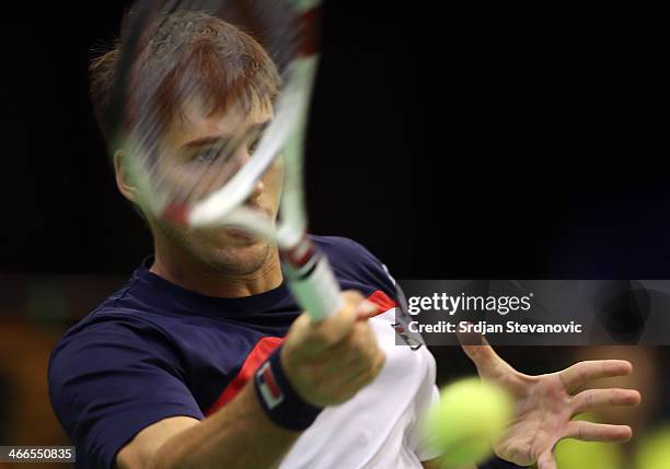 Dusan Lajovic of Serbia plays a forehand against Michael Lammer of Switzerland during the day three of the Davis Cup match between Serbia and...