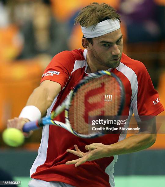 Michael Lammer of Switzerland plays a backhand against Dusan Lajovic of Serbia during the day three of the Davis Cup match between Serbia and...