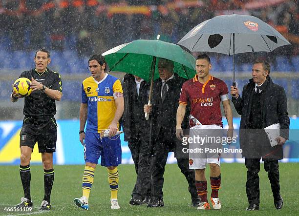 The referee Andrea De Marco with Alessandro Lucarelli of Parma FC and Francesco Totti of AS Roma check the field condition during the Serie A match...