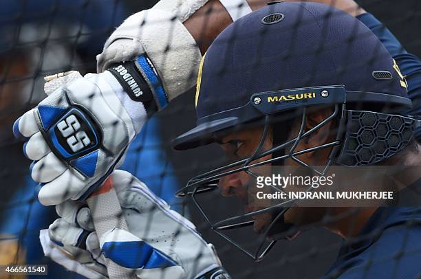 Sri Lanka's Kumar Sangakkara bats in the nets during a training session at the Sydney Cricket Ground on March 17, 2015 ahead of the 2015 Cricket...