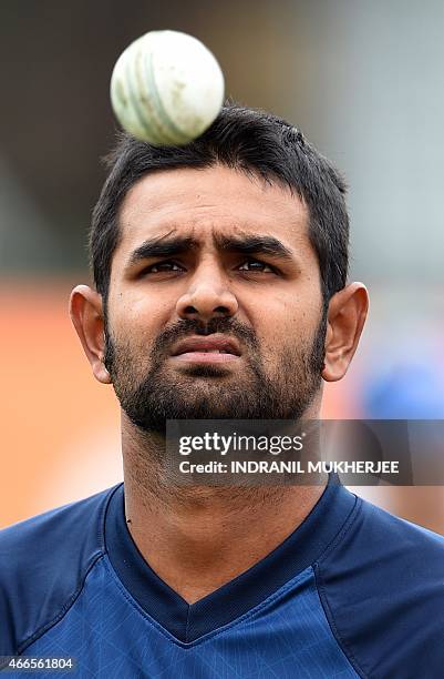 Sri Lankan cricketer Lahiru Thirimanne juggles a ball awaiting his turn to bat in the nets during a training session at the Sydney Cricket Ground on...