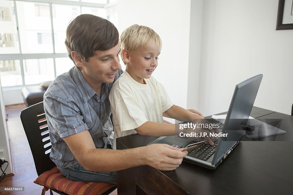Father and son with Laptop