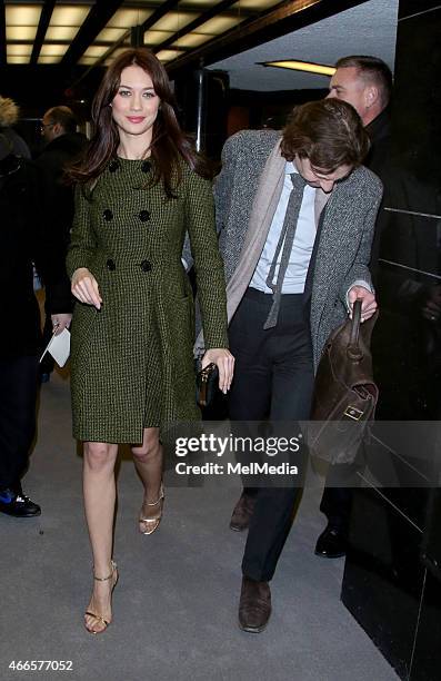 Olga Kurylenko and guest attend the UK premiere of 'Dior And I' at The Curzon Mayfair, on March 16, 2015 in London, England.