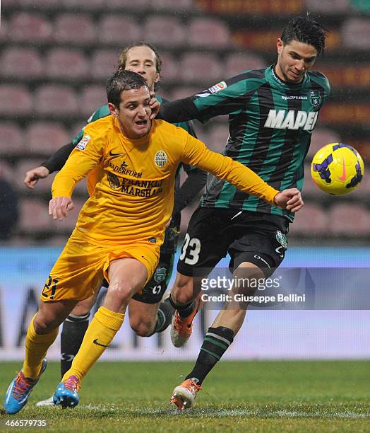 Juan Ignacio Gomez of Hellas Verona and Pedro Mendes of Sassuolo in action during the Serie A match between US Sassuolo Calcio and Hellas Verona FC...