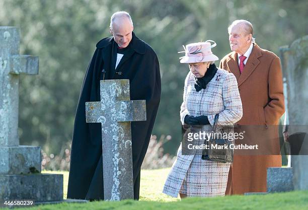 Reverend Jonathan Riviere with Queen Elizabeth II and Prince Philip, Duke of Edinburgh attending church at West Newton on February 2, 2014 in King's...