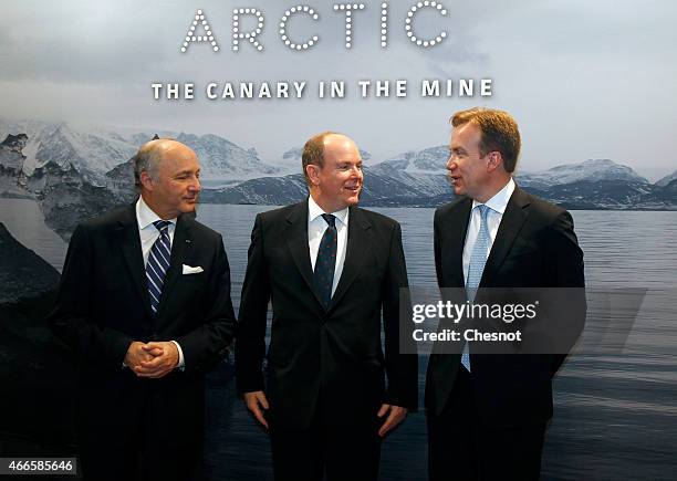 French Foreign Minister Laurent Fabius , Prince Albert II of Monaco and Norway's Foreign Minister Borge Brende pose for photographers ahead of the...