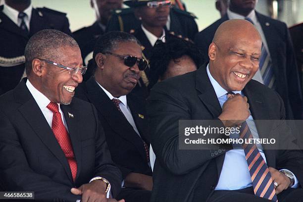 Lesotho Prime Minister Pakalitha Mosisili laughs with King Letsie III of Lesotho on March 17, 2015 during his inauguration ceremony in Maseru. AFP...