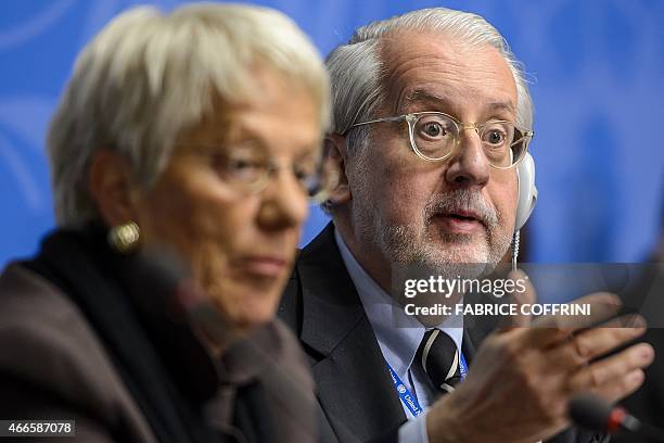 Chaiman of the United Nations Commission of Inquiry on Syria, Paulo Sergio Pinheiro gestures next to Carla del Ponte during a press conference on...